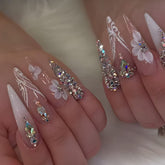 VIBEFICANT GLAZE Long Stiletto Ombre Nude Press-On Nails with rhinestones and floral designs.